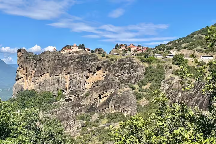Panoramic Meteora cliffs and hilltop monasteries in Thessaly, Greece, seen on a full-day private scenic tour