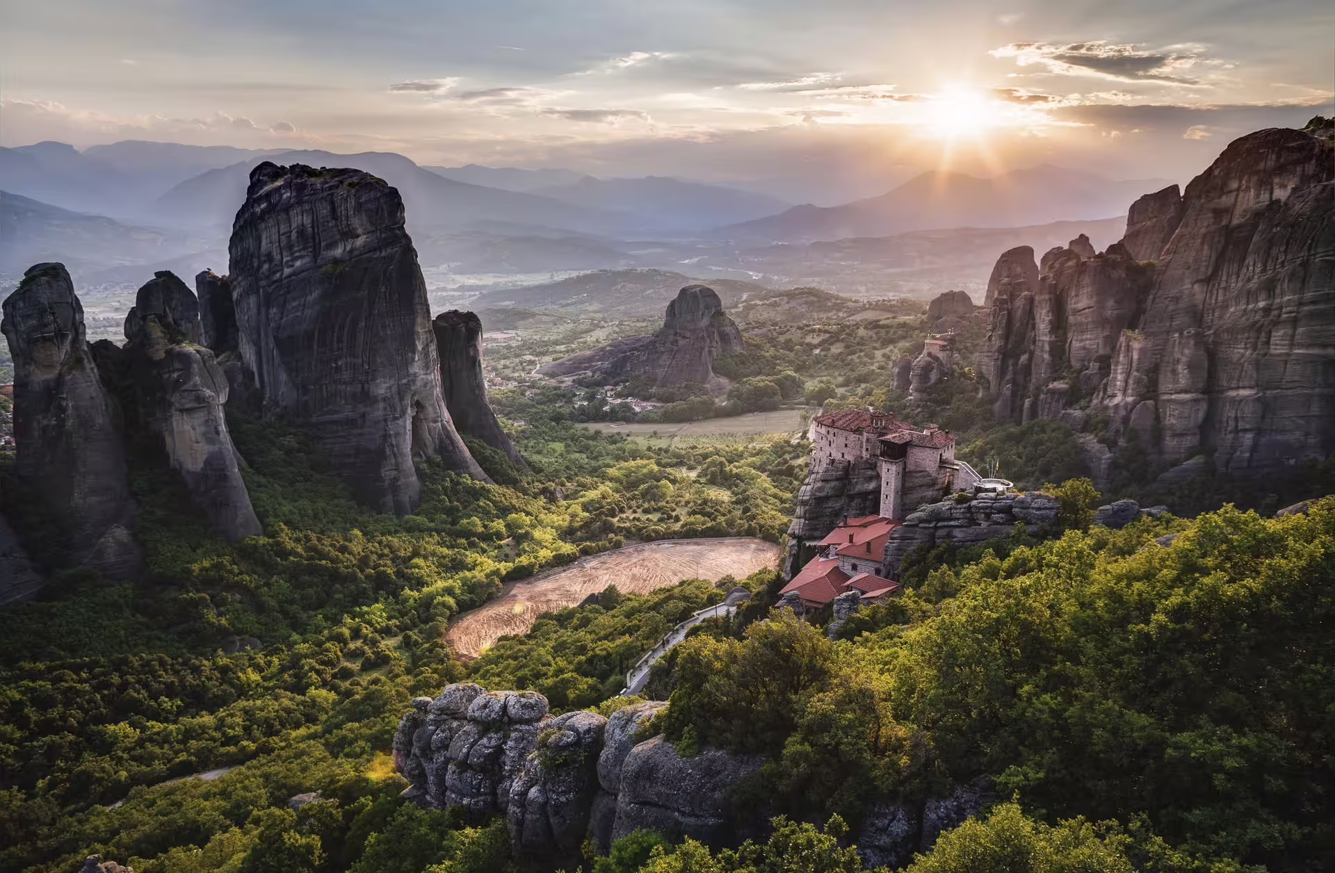 Sunset over Meteora rock formations and monasteries near Kalambaka, scenic stop on 2-day private tour