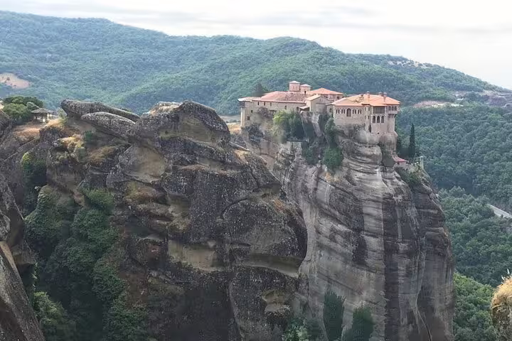 Panoramic view of Meteora monastery on high rock formation, must-see landmark on private Athens day tour