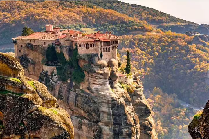Meteora cliff-top monastery in autumn, highlight of Delphi and Meteora 2-day tour from Athens, Greece