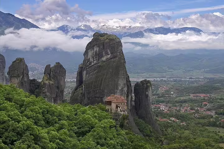 Meteora cliffs and hilltop monastery view, scenic stop on full-day private tour from Athens, Greece