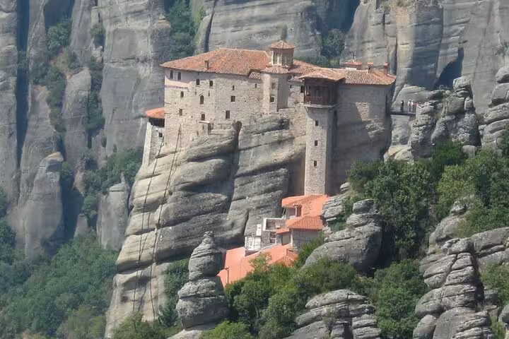 Meteora cliffside monastery on towering rock pillars, highlight of Athens full-day private tour Greece