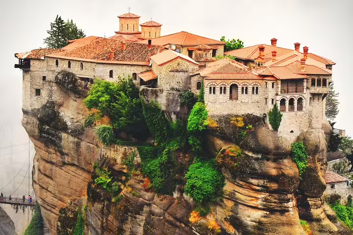 Close-up of Meteora monastery complex atop steep rock, iconic stop on a full-day private tour in Greece