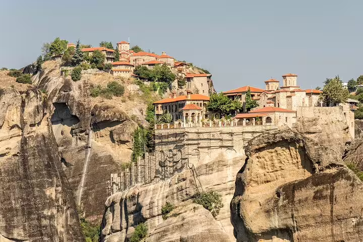 Close-up of a historic Meteora monastery built atop rocky cliffs, showcasing exquisite architecture in Greece.