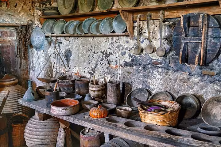 Traditional Meteora monastery kitchen with rustic pots and utensils on full-day private tour from Athens