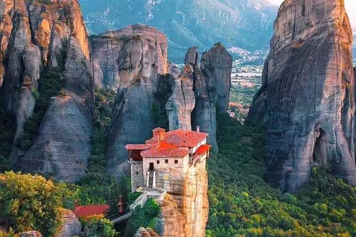 Meteora monastery perched on a towering rock pillar, highlight of a private day tour from Athens, Greece