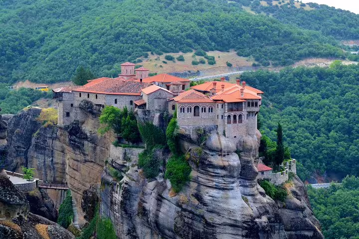 Panoramic view of Meteora monastery on dramatic rock pillar, highlight of Delphi and Meteora two-day tour