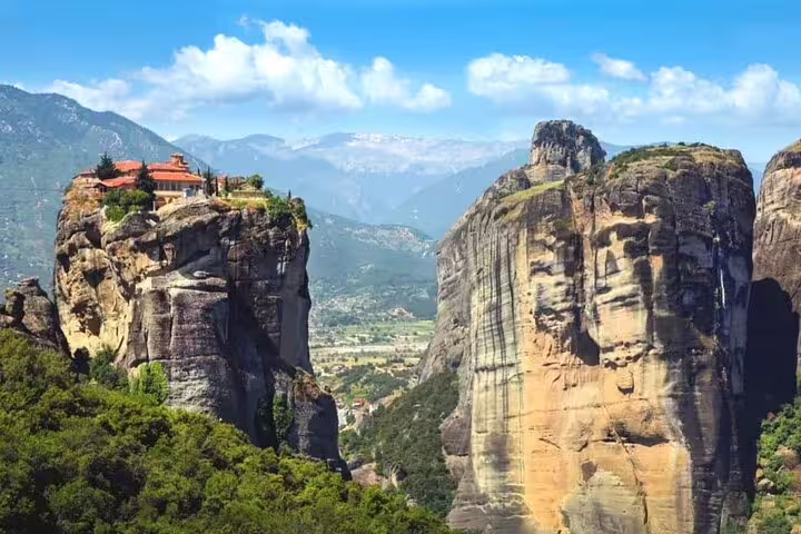 Meteora monastery perched on towering rock pillars, scenic stop on a private day tour from Athens, Greece