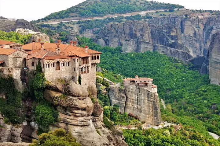 Meteora monastery perched on towering sandstone cliffs, scenic stop on private day tour from Athens, Greece