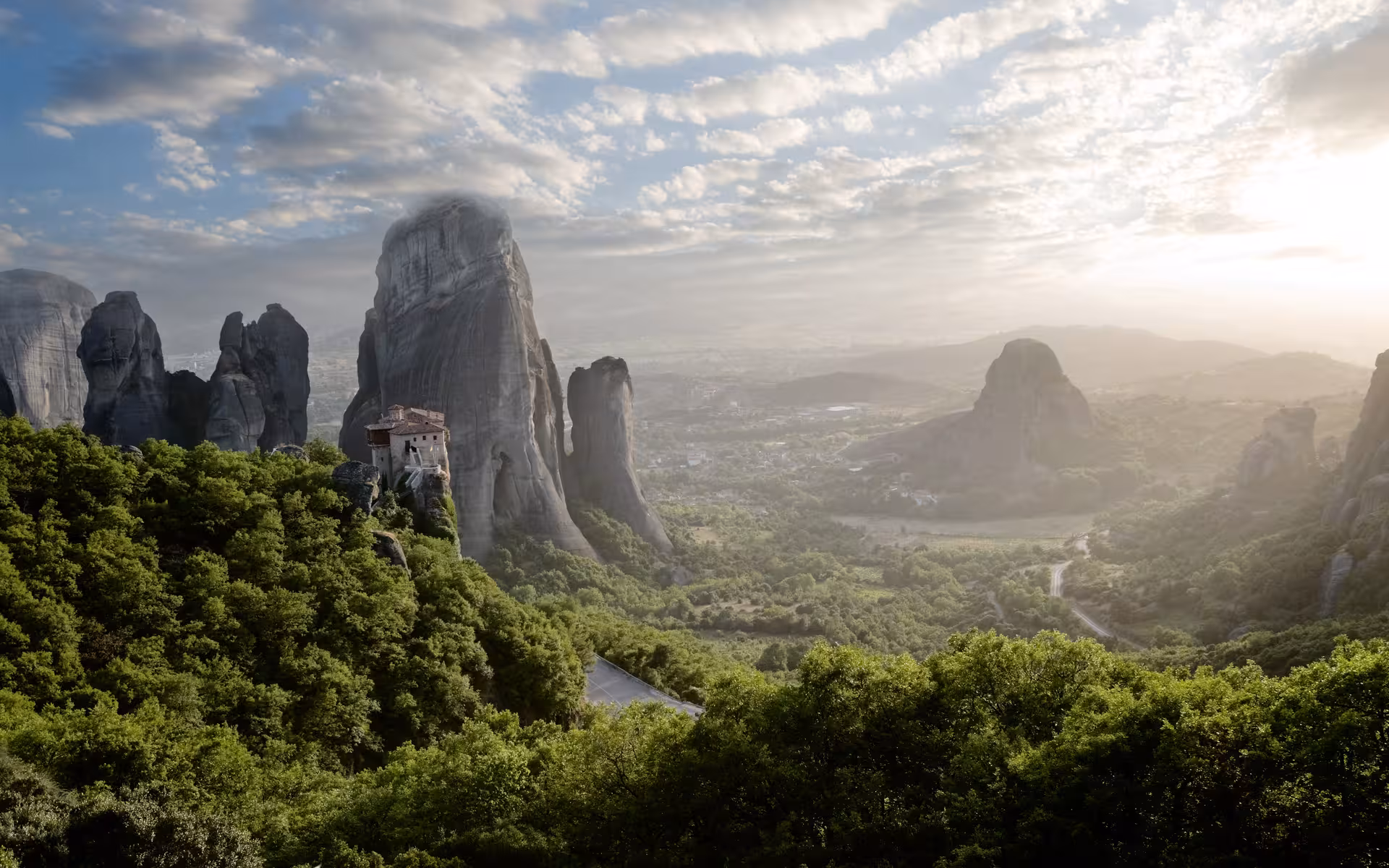 Sunrise over Meteora rock pillars and cliffside monastery, highlight of the 4-day Classical Greece tour