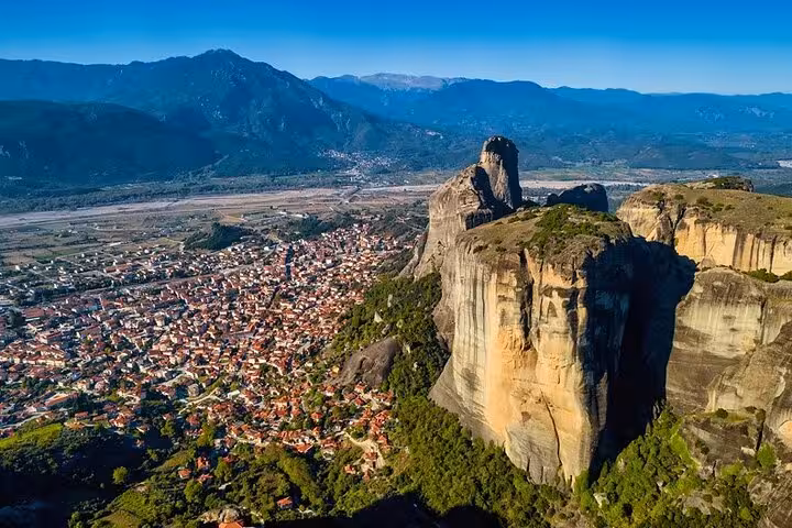 Aerial view of Meteora rock pillars and Kalabaka town, scenic private day trip from Athens