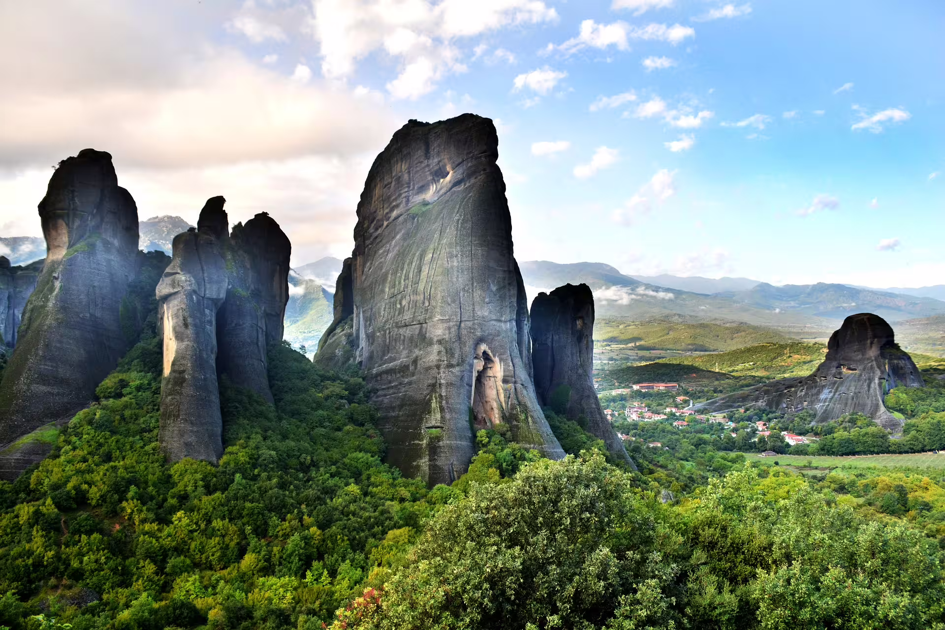 Meteora sandstone pillars above green valley on 2-day private tour from Athens with Kalambaka overnight stay