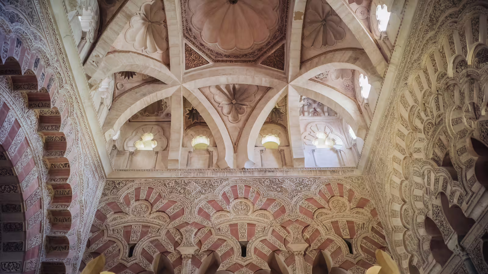 Ornate arches and vaulted ceiling inside the Mezquita of Cordoba, highlight of a private Costa del Sol tour