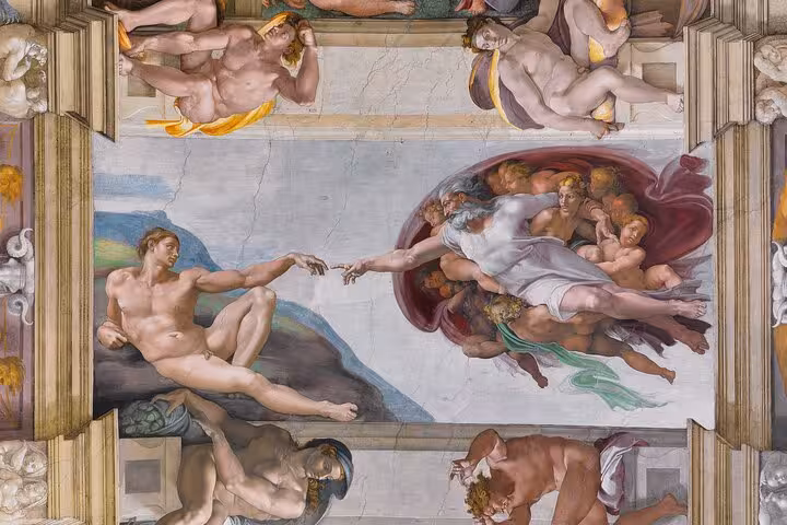 Close-up of Michelangelo's 'The Creation of Adam' fresco on the Sistine Chapel ceiling during Vatican guided tour.