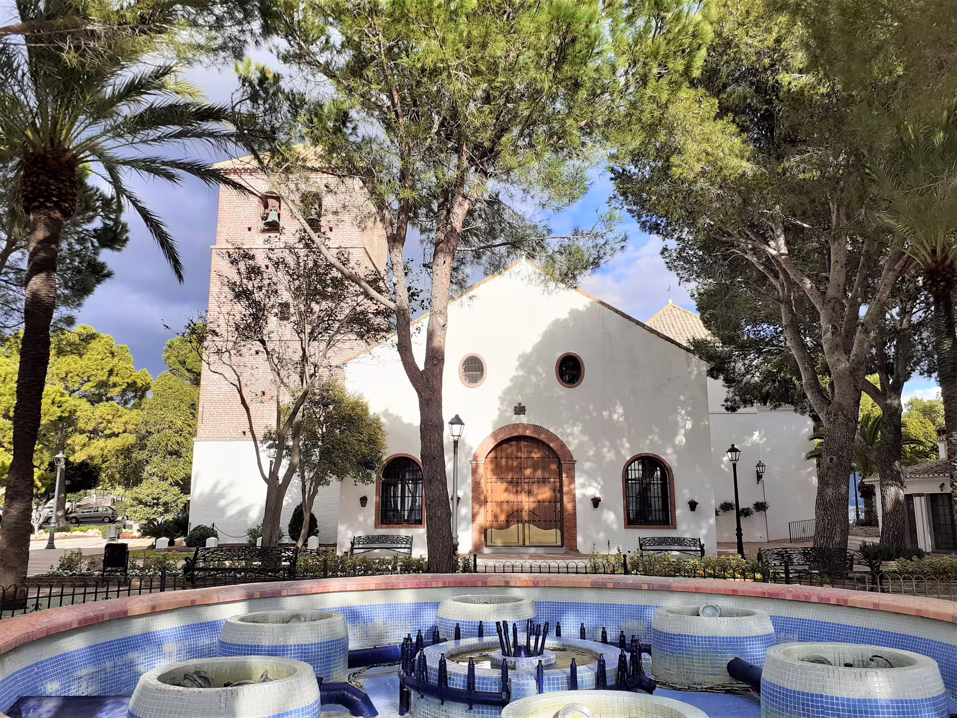 White church and fountain in Mijas Pueblo on a private day trip from Costa del Sol, Andalusia
