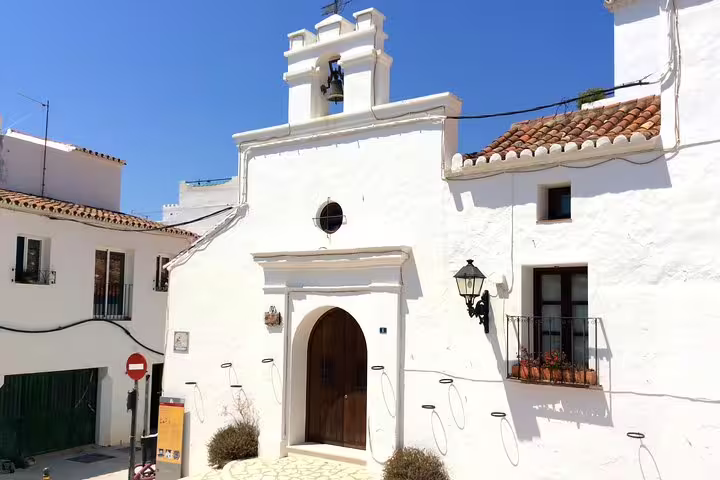 Whitewashed chapel in Mijas Pueblo old town, iconic Andalusian stop on Costa del Sol day trip