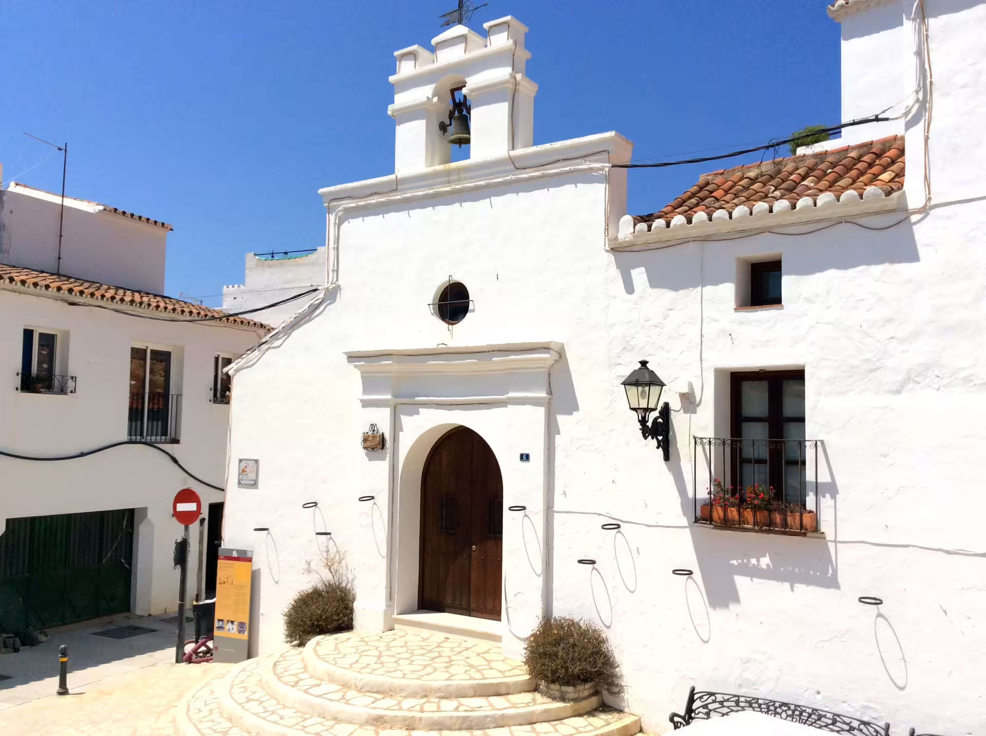 Whitewashed Mijas Pueblo chapel and tiled roofs on a private day trip from Costa del Sol, Andalusia