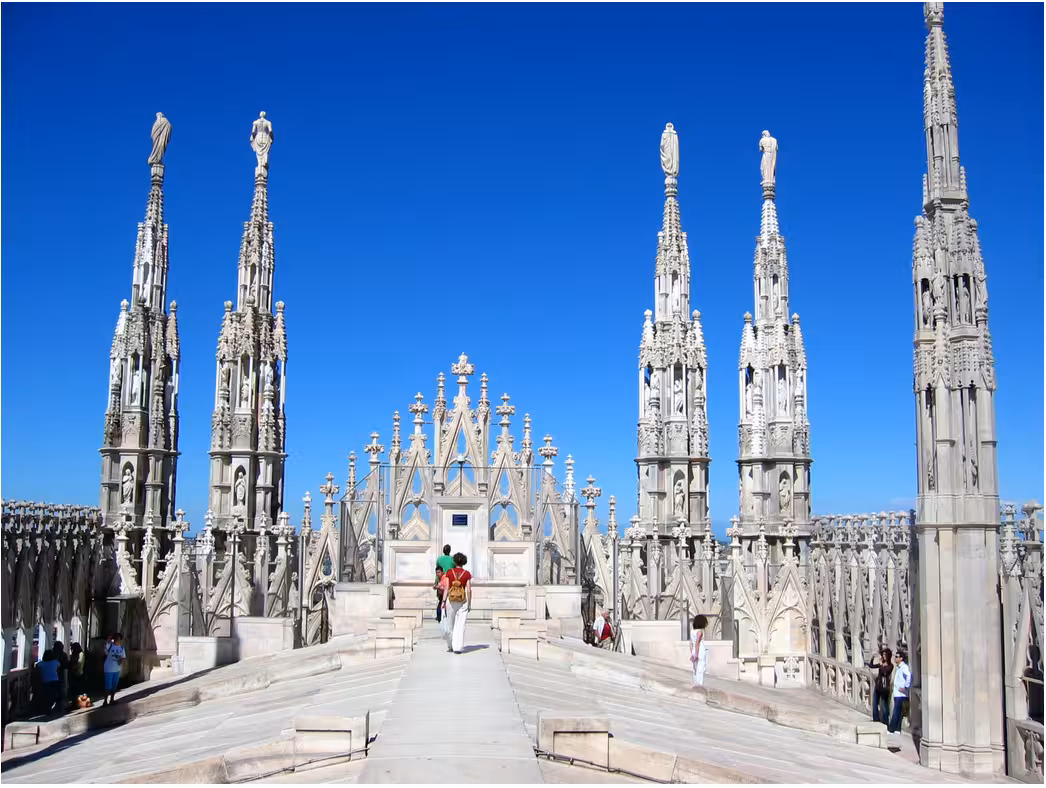 Stunning rooftop view of Milan Cathedral, featuring intricate spires on exclusive guided tours.