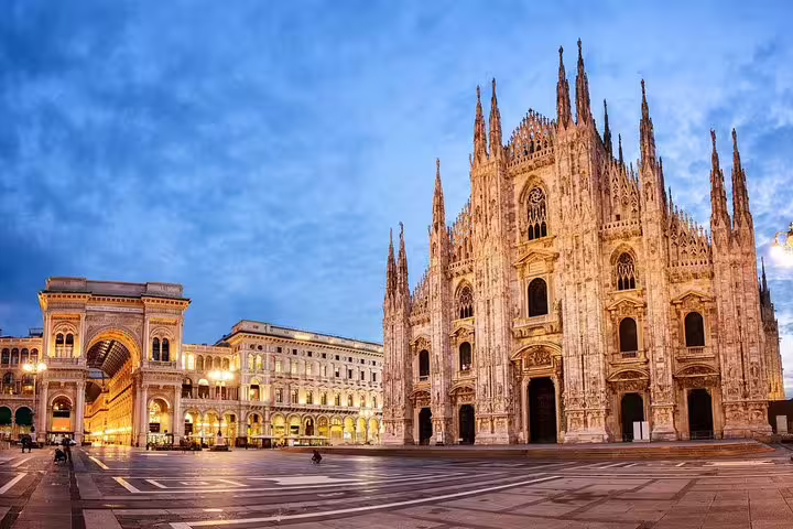 Twilight view of Milan Duomo Cathedral and Piazza del Duomo, ideal for a private guided tour of the iconic Gothic landmark