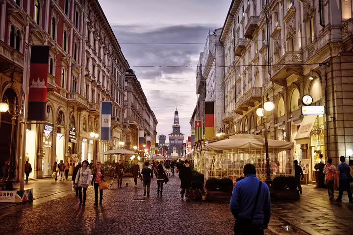 Evening stroll along a lively shopping street near Milan Duomo, a popular add-on to a private cathedral tour with local guide