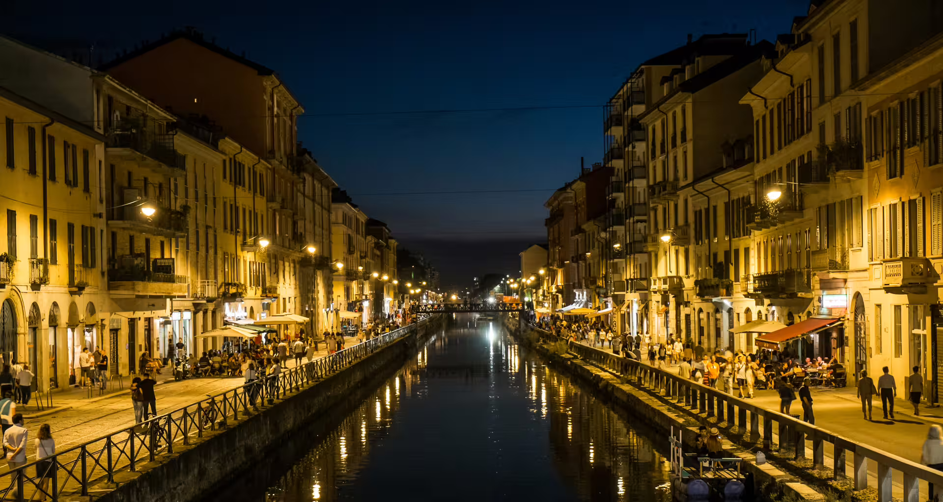 Evening stroll along Milan’s lively Navigli canal district, with waterfront cafés and golden lights on an Italy 8-day tour