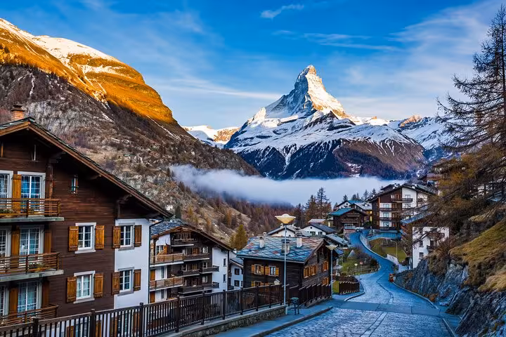 Scenic view of Zermatt village with the Matterhorn at sunrise, perfect for a private transfer from Milan to Zermatt Tasch.