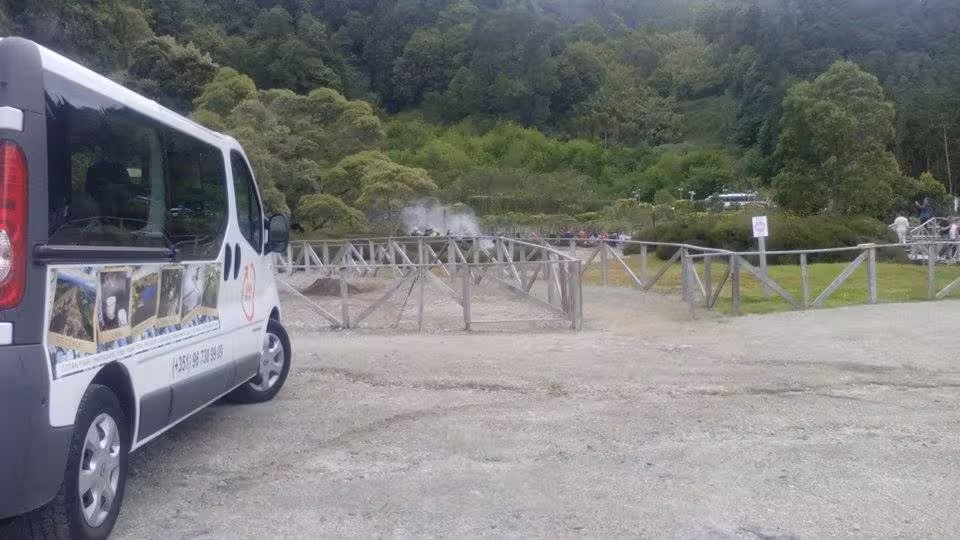 Minibus arriving at Furnas geothermal area on São Miguel full-day Lake Tour with steaming fumaroles