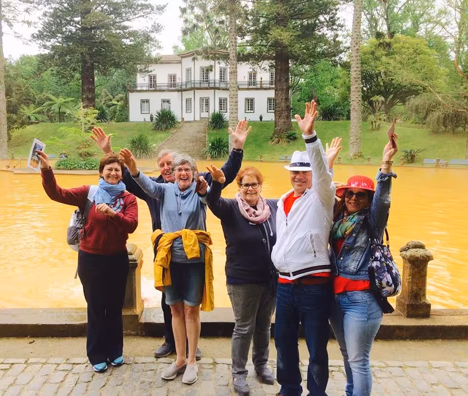 Happy group at Terra Nostra Garden thermal pool in Furnas on São Miguel full-day Lake Tour by minibus