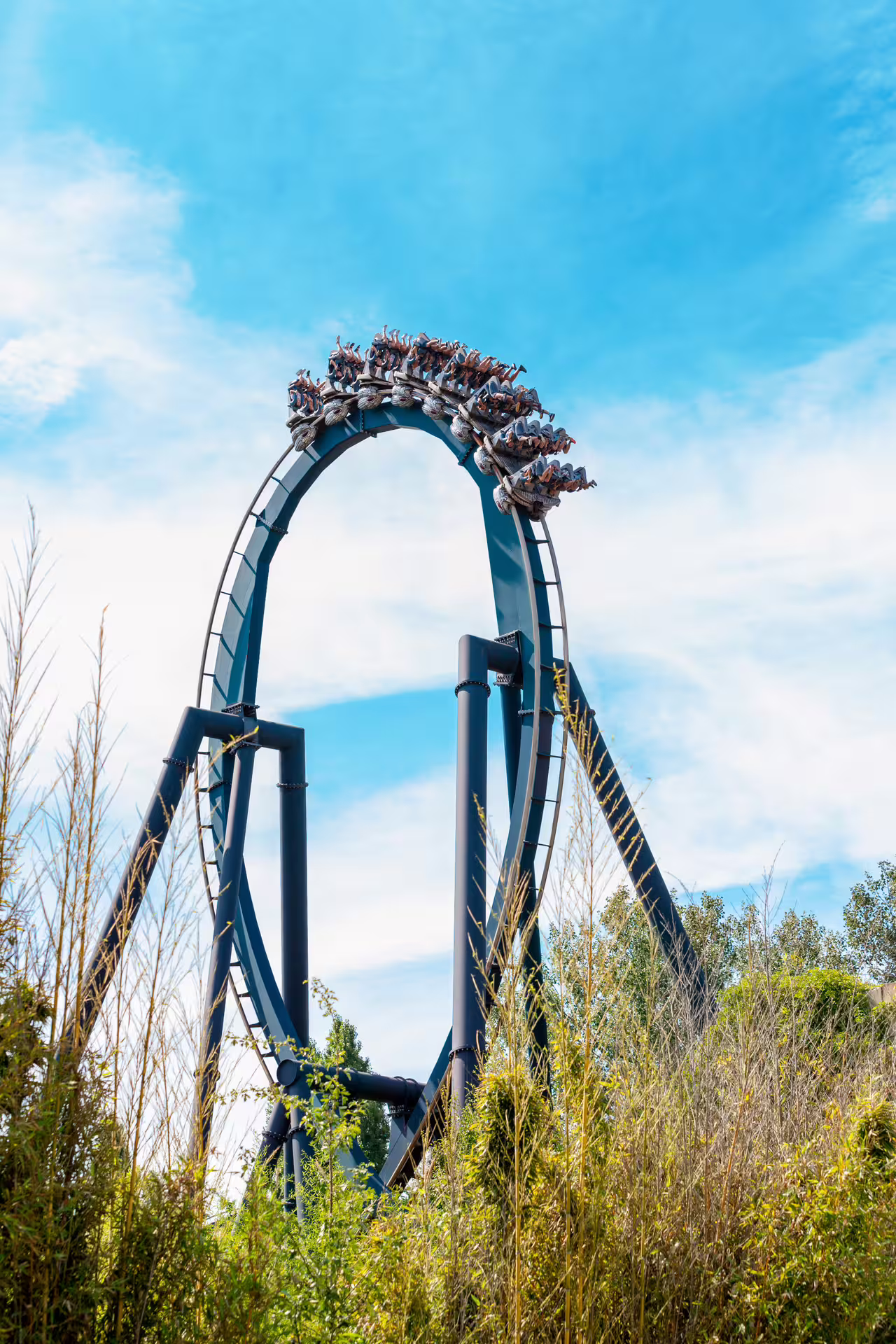 Mirabilandia theme park roller coaster loop under blue sky, part of ticket with Maranello Museum visit