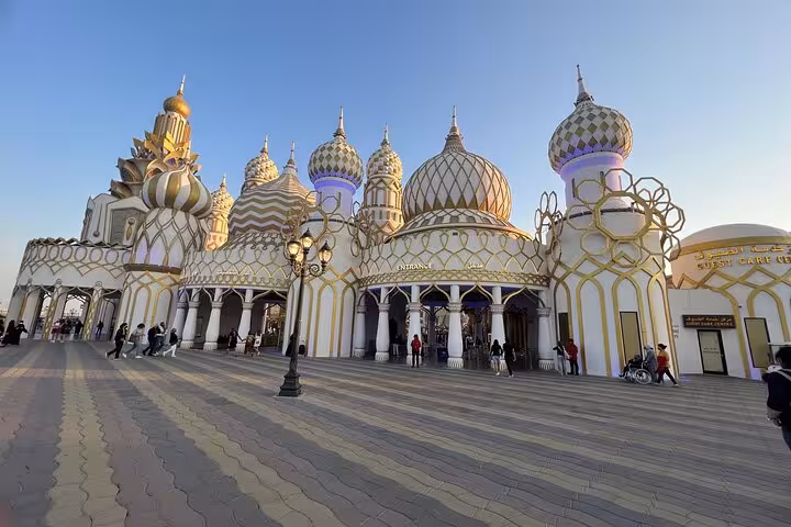 Dubai Global Village-style domed pavilion entrance with visitors, easy add-on with Ras AlKhaimah ticket/pass adventure