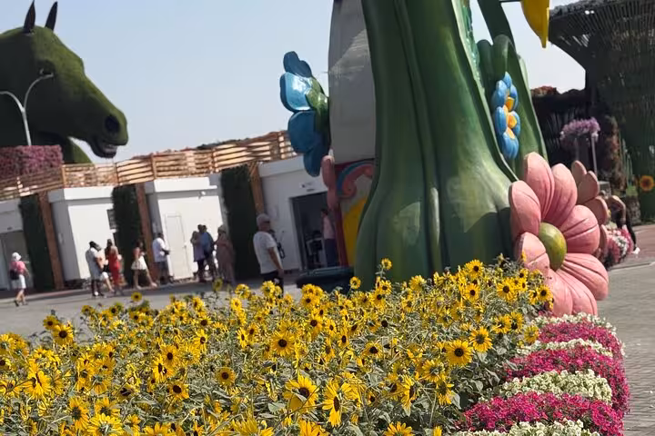 Colorful flower beds and whimsical garden sculptures at Ras Al Khaimah adventure pass attraction