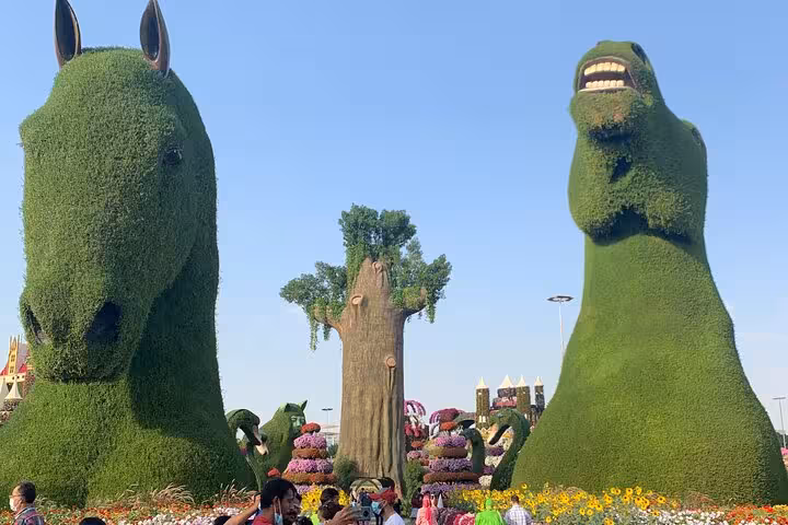 Giant topiary horse and dinosaur sculptures with sunflowers, Ras Al Khaimah ticket/pass adventure await