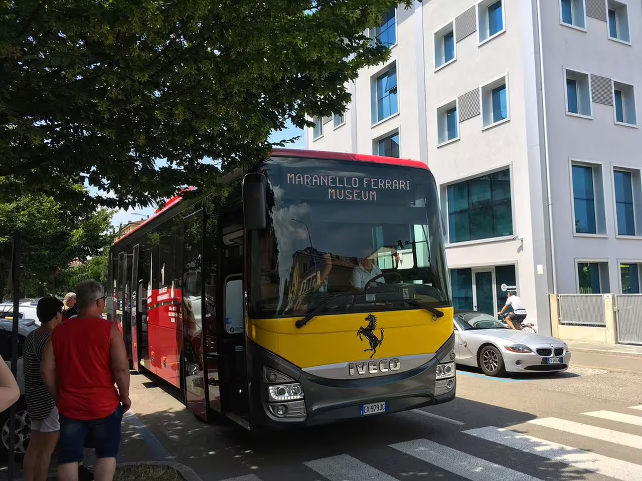 Front view of Maranello Ferrari Museum shuttle bus in Modena, bus transfer to Enzo Ferrari Museum
