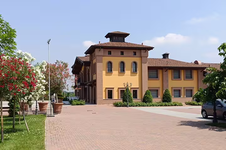 Historic Modena estate with ochre villa, gardens and courtyard, a scenic stop on a private Ferrari Museum and balsamic tour