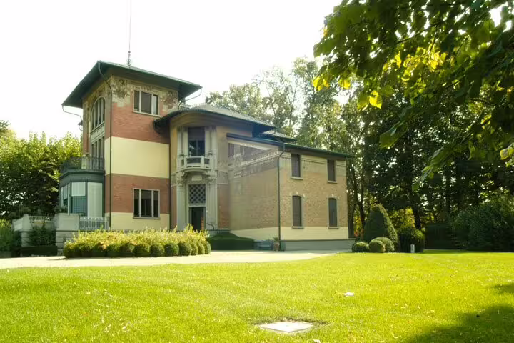 Elegant Modena villa surrounded by manicured gardens, a scenic stop on the private Ferrari Museum and balsamic vinegar tour