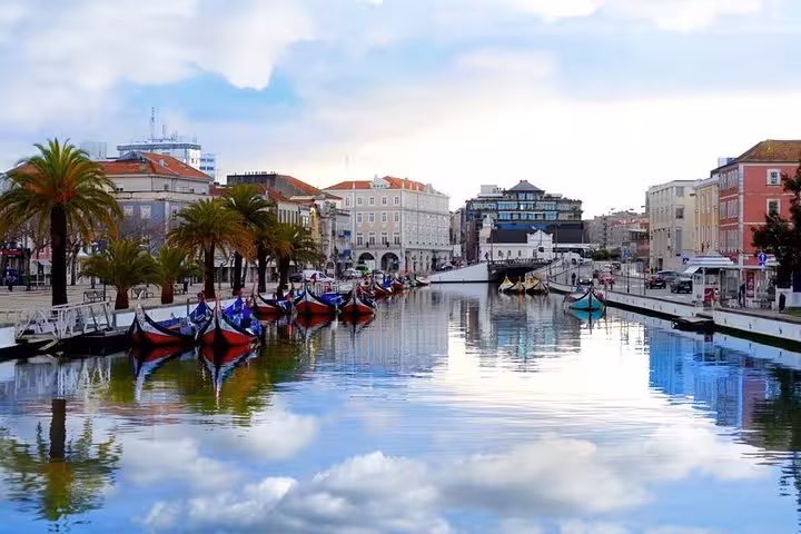Colorful moliceiro boats on Aveiro canal, Portugal, scenic stop on day trip to Coimbra and Figueira da Foz