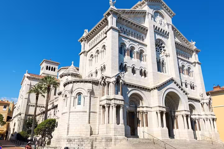 Stunning exterior of the Cathedral of Monaco, showcasing intricate architecture against a clear blue sky.