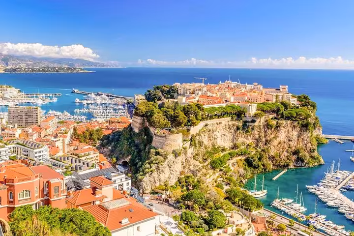 Breathtaking aerial view of Monaco's scenic coastline and marina, perfect for a private shore excursion from Cannes.
