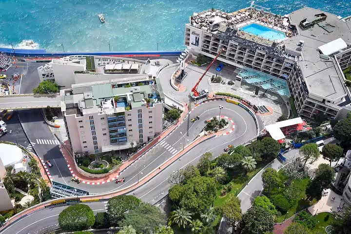 Aerial view of the iconic Monte Carlo racetrack winding through the city, ideal for a Monaco private tour experience.