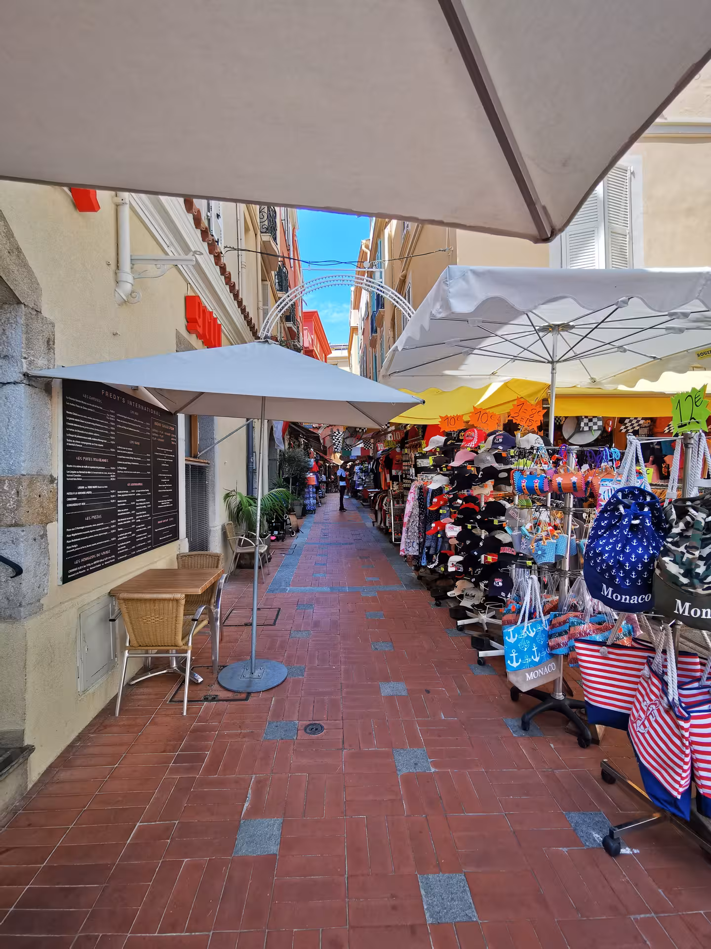 Monaco old town market lane with souvenir stalls, ideal stop on Marseille shore excursion to Nice, Eze and Monaco