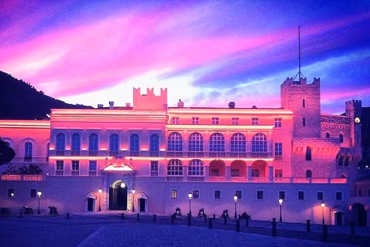 Monaco's illuminated palace at sunset, highlighting breathtaking architecture on a luxury private day tour.