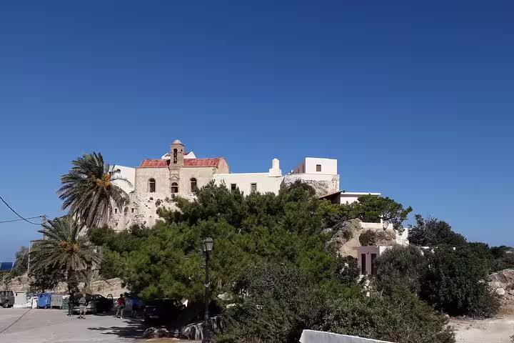 Historic monastery surrounded by greenery en route to Elafonissi Beach on a private tour from Rethymno.
