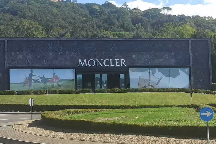 Elegant Moncler outlet boutique at The Mall Florence included in private chauffeur-driven luxury shopping tour