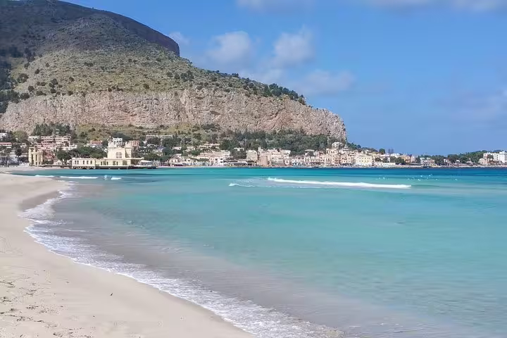 Mondello Beach near Palermo with turquoise water, golden sand and rocky cliffs, visited on the Monreale and Mondello private tour