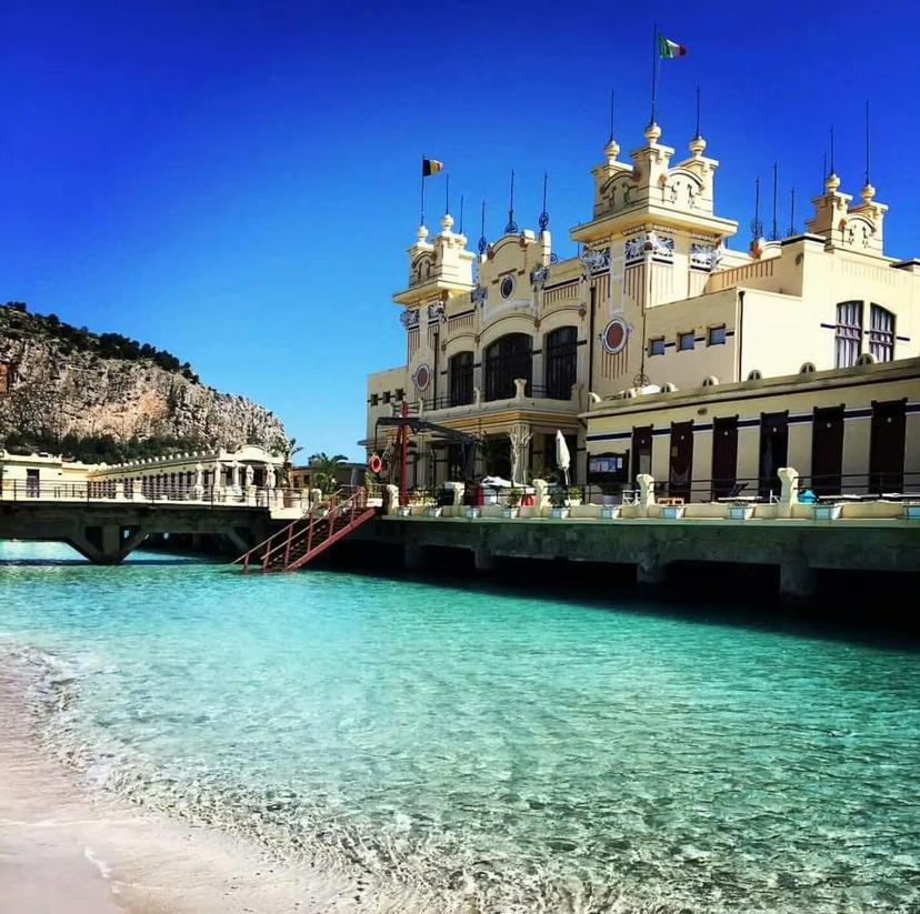 Art Nouveau Mondello beach pavilion over turquoise water near Palermo, featured on private Monreale and Mondello coastal tours