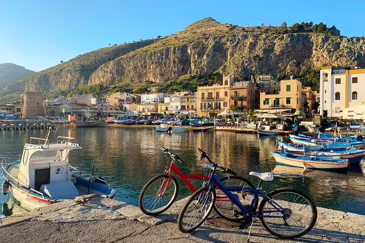 Harbor view with boats and bicycles in Mondello near Palermo, coastal highlight on private Sicilian day trip tour