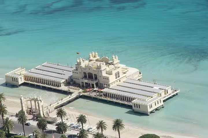 Liberty-style Mondello pier and beach club over crystal-clear sea near Palermo, seen on a private Monreale and Mondello tour