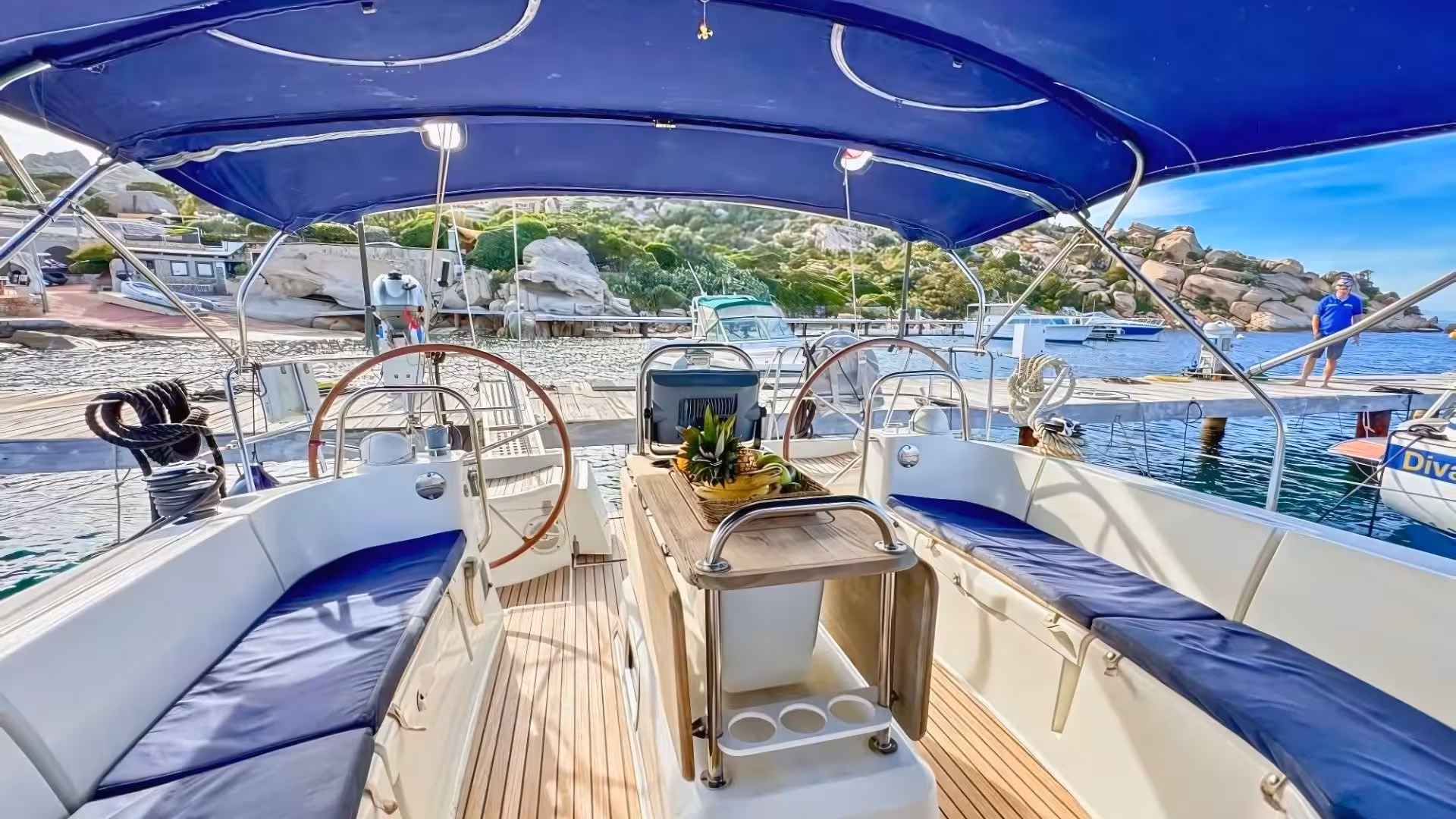Spacious sailing boat interior ready for La Maddalena Archipelago tour from Cannigione, featuring comfortable seating.