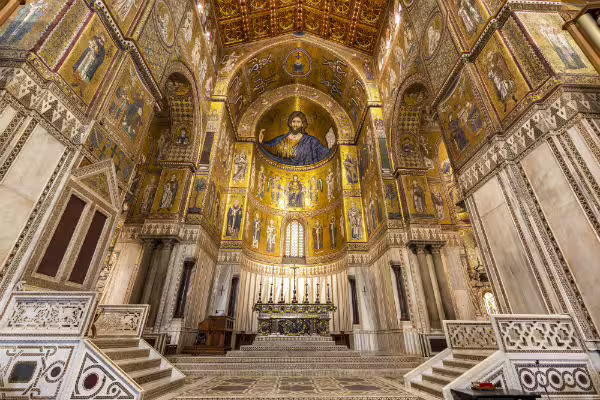 Opulent gold mosaic apse and marble altar of Monreale Cathedral, must-see stop on Monreale and Mondello private tour from Palermo
