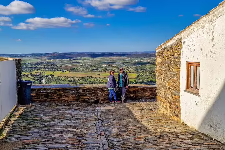 View from Monsaraz showcasing scenic landscapes and medieval architecture during a day trip from Lisbon to Évora and Monsaraz.